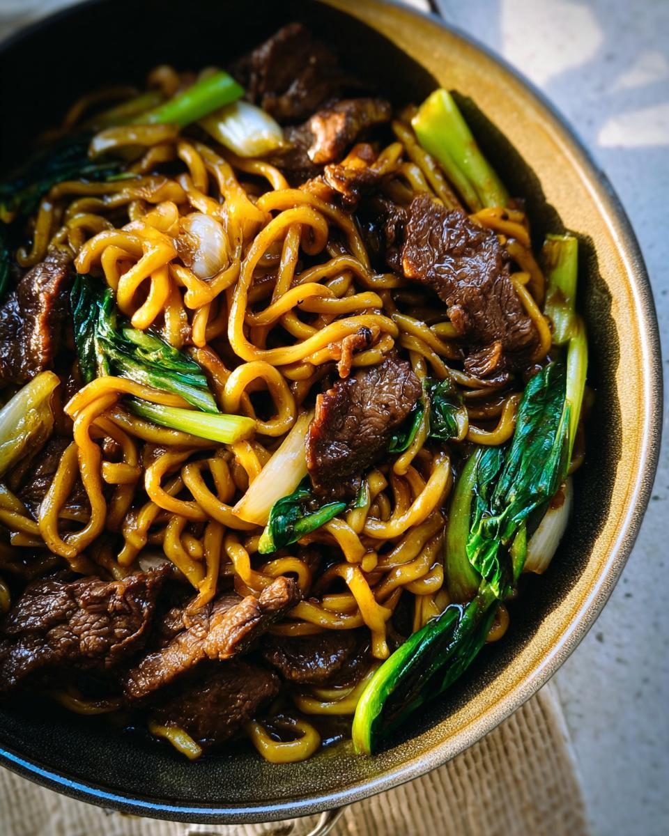 Close-up of a bowl of beef and bok choy noodles, a delicious and easy dinner recipe.