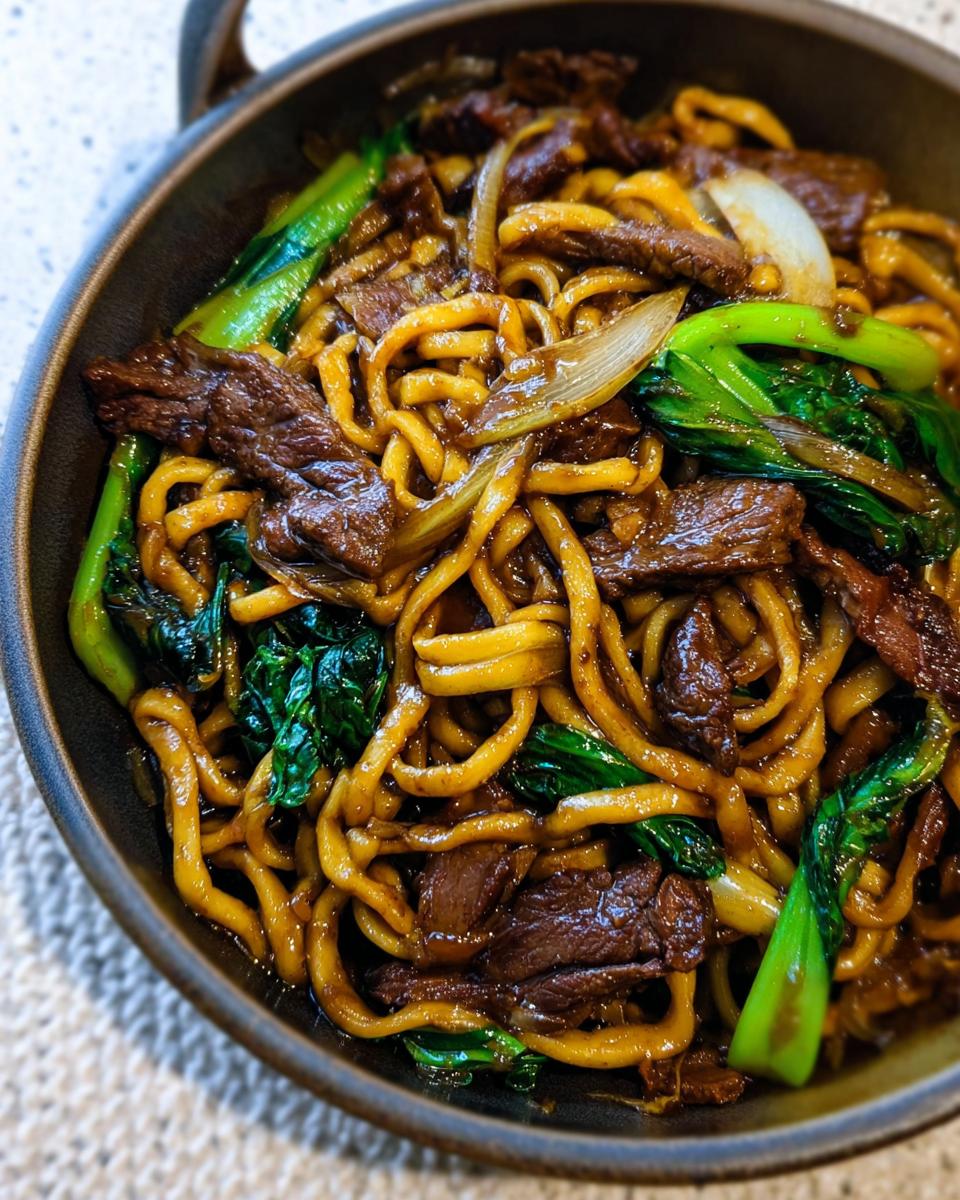 Close-up of a bowl of delicious beef and noodles with bok choy, a perfect easy dinner recipe.