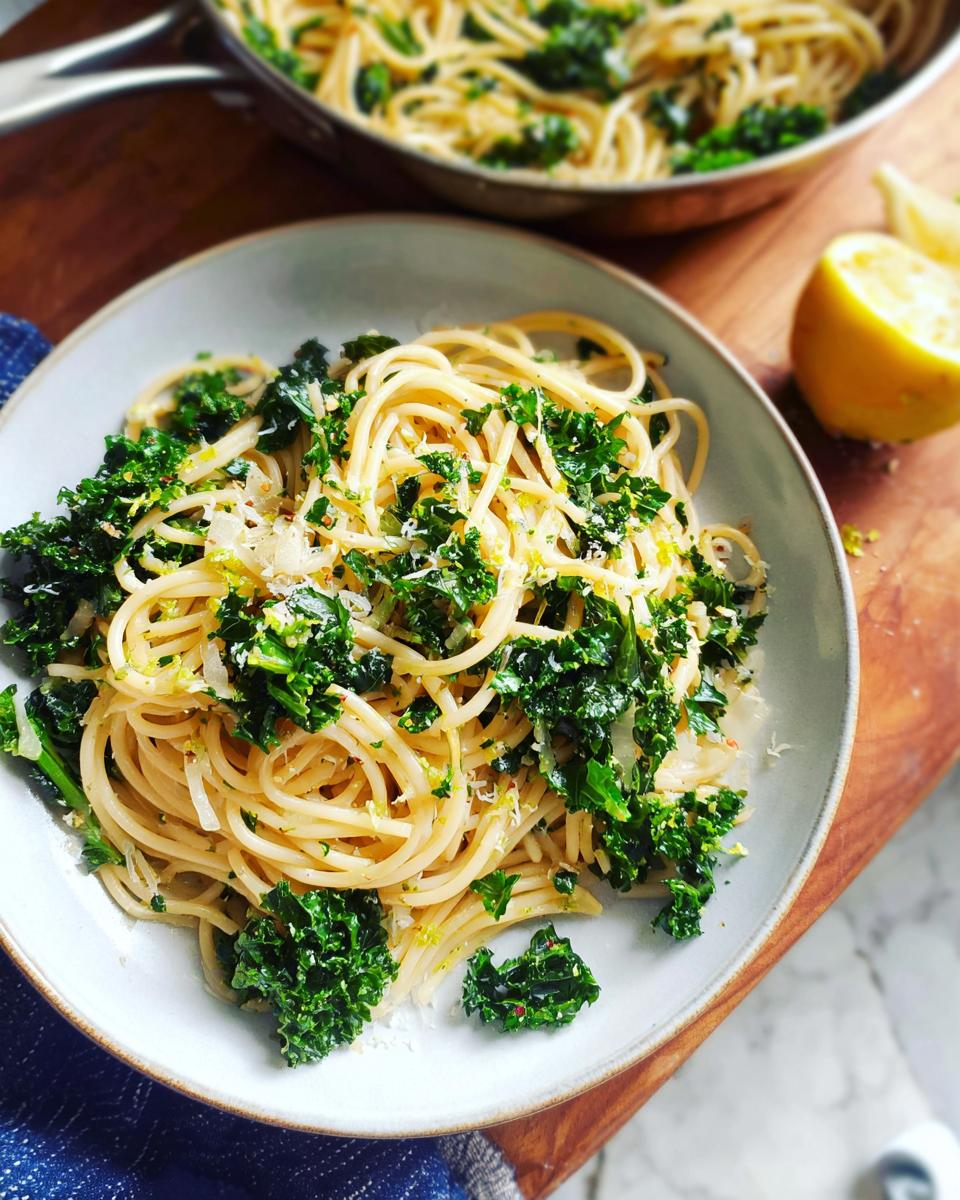 A bowl of spaghetti with kale and lemon zest, a perfect easy dinner recipe.