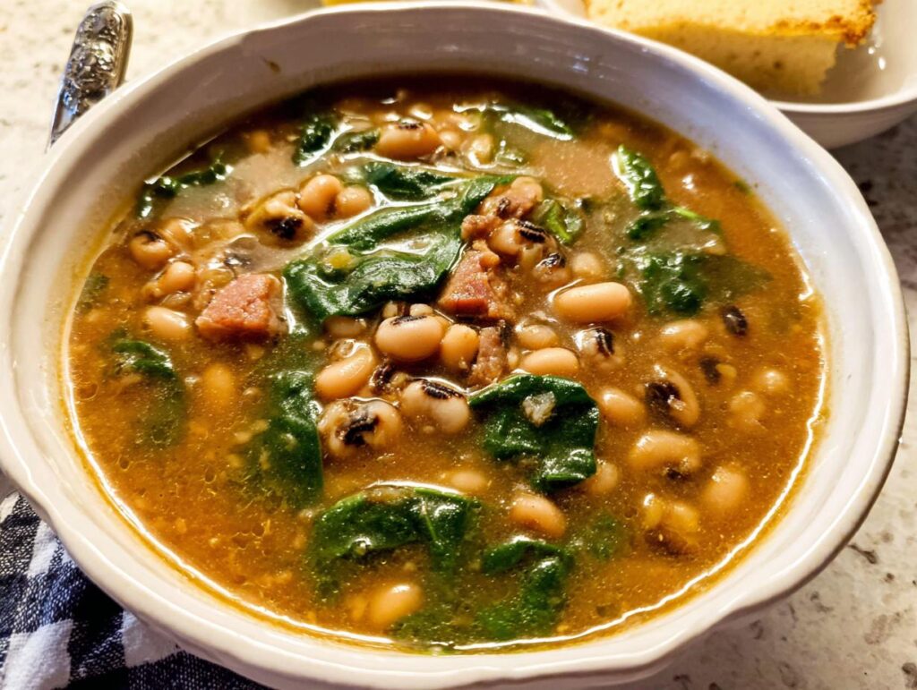 A close-up of a bowl of hearty black eyed pea soup with spinach and ham, part of The Ultimate Soup Recipes Guide for Beginners.