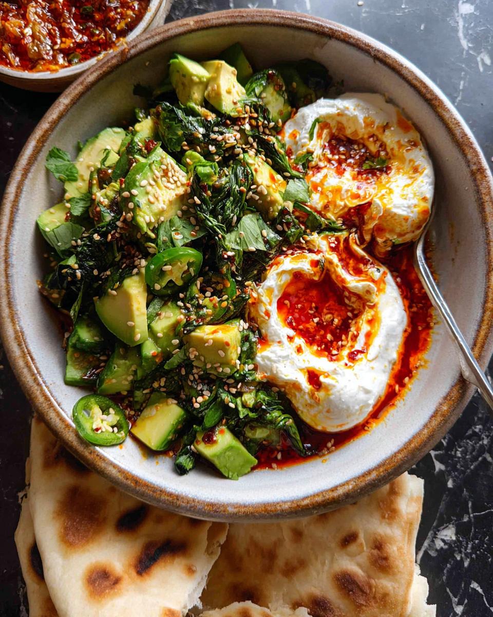 A vibrant and healthy meal featuring avocado, greens, yogurt, and chili oil, perfect for healthy meals recipes.