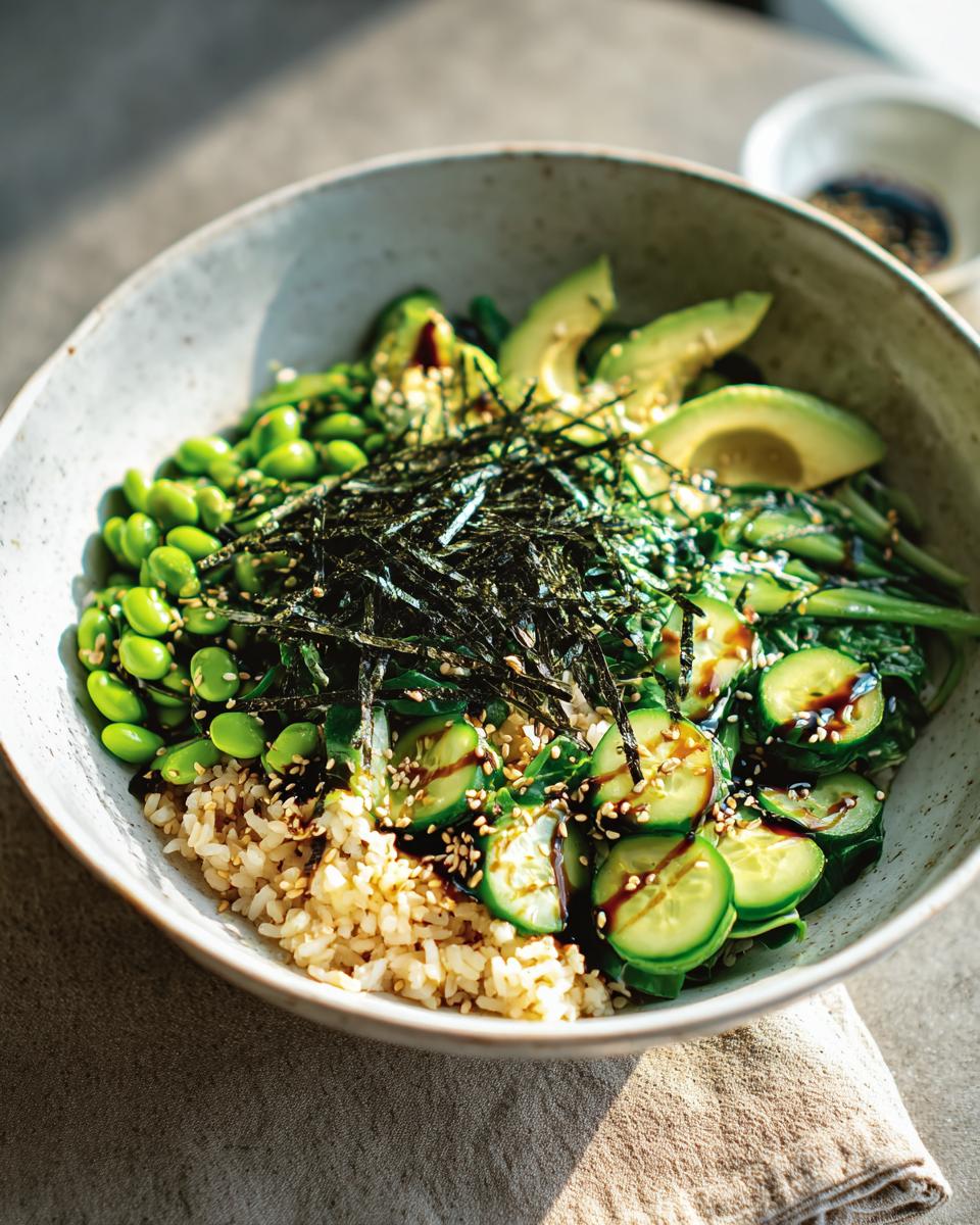 A vibrant and healthy rice bowl with brown rice, edamame, avocado, cucumber, and nori, part of The Ultimate Rice Bowls Recipes Guide for Beginners.