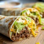 Close-up of a Homemade Big Mac Wrap filled with seasoned ground beef, shredded lettuce, cheese, and sauce.