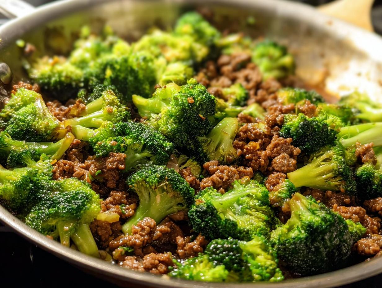 Close-up of a Keto Hamburger Broccoli Skillet in a pan, showing seasoned ground beef and bright green broccoli florets.