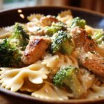 A close-up of Cowboy Butter Lemon Bowtie Chicken Pasta with Broccoli, featuring tender chicken pieces, vibrant broccoli florets, and creamy sauce.