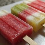Close-up of three colorful watermelon recipes with coconut lime popsicles, perfect for kids.